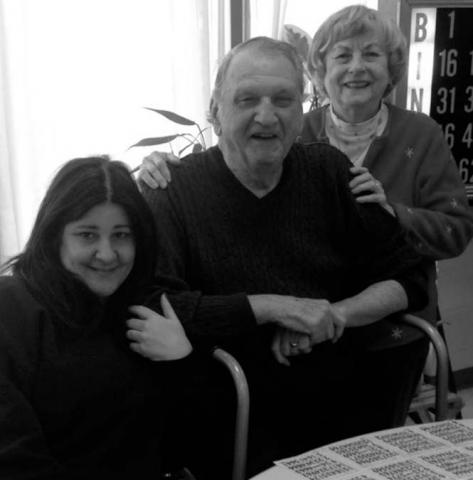 Jennifer and her adoptive parents playing bingo at the Yonkers Senior Center when she went home to visit in 2009.